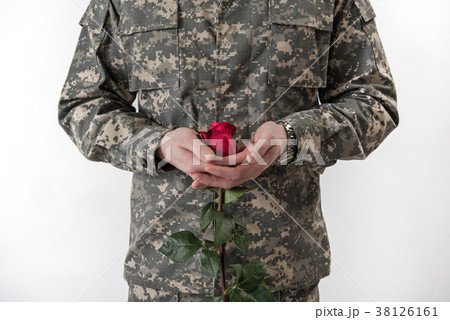 Military man having flower in hand Military man having flower in hand 38126161