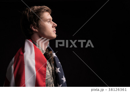 Sad soldier believing in his country Sad soldier believing in his country 38126361