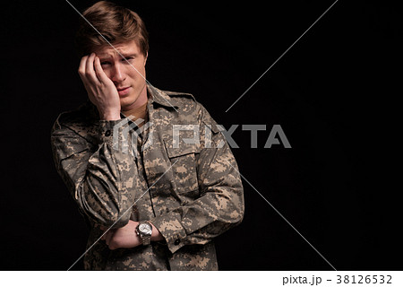 Upset male officer regretting his past 38126532