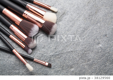 Various makeup brushes isolated 38129560
