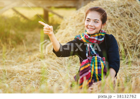 farmer woman resting with the straw in field 38132762