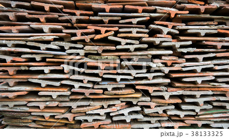 Tiles of different shades are stacked in pile. Tiles of different shades are stacked in pile. 38133325
