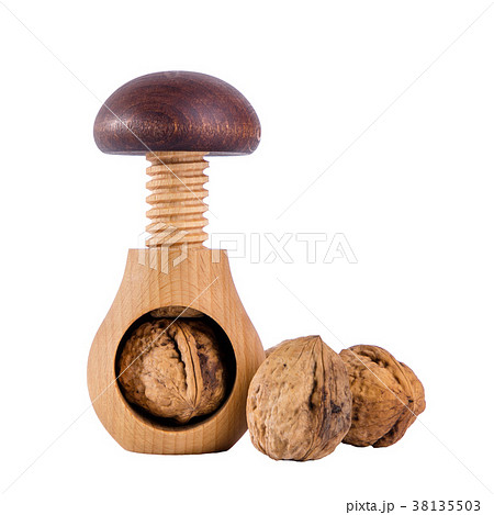 Whole walnuts and wooden screw nutcracker  38135503