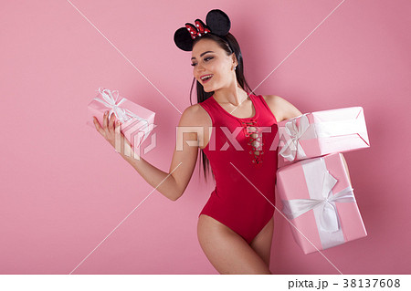 beautiful girl with pink presents for the holiday beautiful girl with pink presents for the holiday 38137608