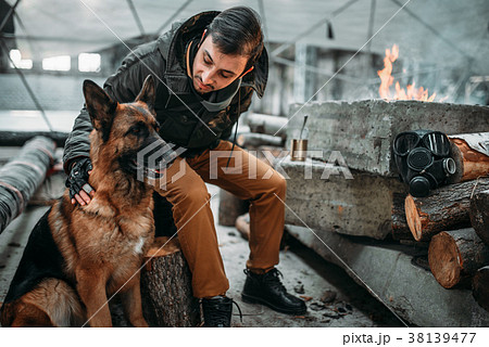 Stalker, post-apocalypse soldier feeding a dog 38139477