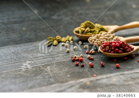Close up three wooden spoons with colorful spices Close up three wooden spoons with colorful spices 38140663