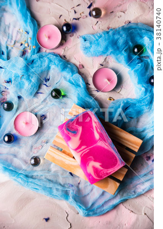 Romantic background with candles, soap and shawl Romantic background with candles, soap and shawl 38140740