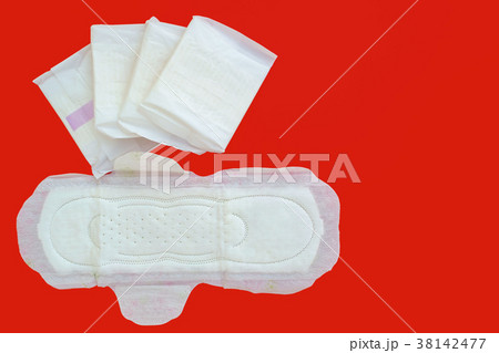 Feminine sanitary napkin on red background 38142477