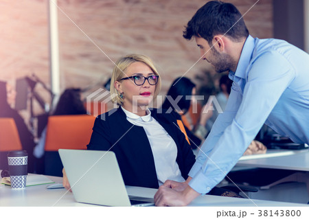 Skilled professional blonde female CEO explaining 38143800