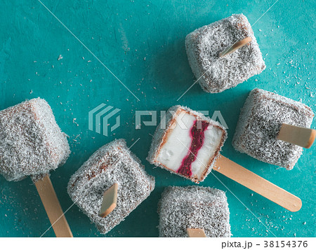 Lamington ice cream pops on blue, top view 38154376