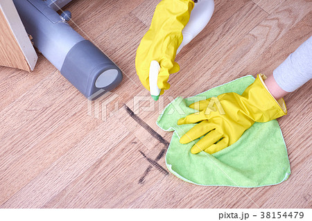 A picture of women hands in yellow gloves cleaning A picture of women hands in yellow gloves cleaning 38154479