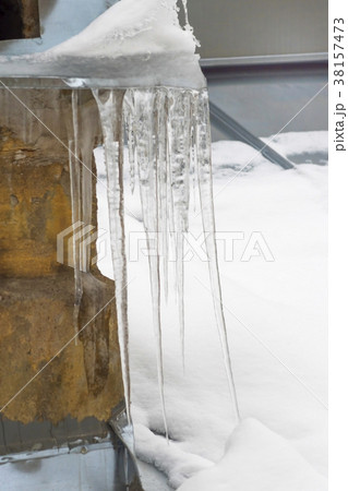 Icicles on the chimney on the roof Icicles on the chimney on the roof 38157473