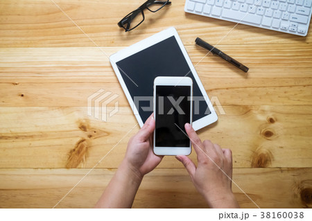 Asian woman hand holding smart phone Asian woman hand holding smart phone 38160038