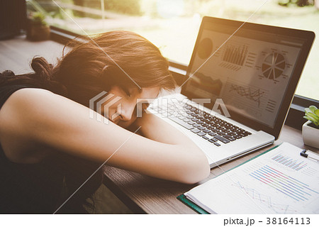 Business woman tired from working with laptop computer. Relax Sl Business woman tired from working with laptop computer. Relax Sl 38164113