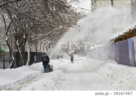 Municipal worker removing snow from the moscow Municipal worker removing snow from the moscow 38167467
