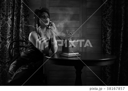 Beautiful 1930s girl smokes monochrome 38167857