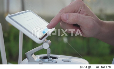 Monitor and control panel drone. Man using a Monitor and control panel drone. Man using a 38168476