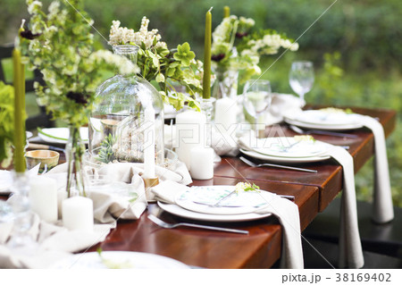 Decoration of wedding table with vases, flowers 38169402