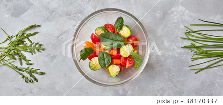 Sliced raw vegetables in a plate 38170337
