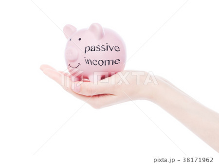 Female hand holds piggy bank passive income text Female hand holds piggy bank passive income text 38171962