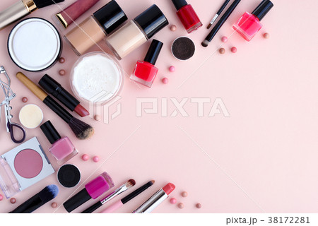 Makeup brush and decorative cosmetics on pink 38172281