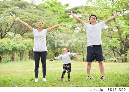 Happy Asian family workout at the park. Happy Asian family workout at the park. 38174366