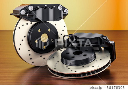 Car discs brake and calipers on the wooden table Car discs brake and calipers on the wooden table 38176303