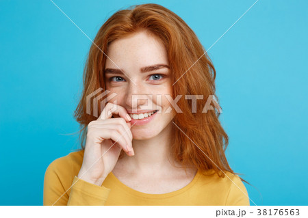 Headshot Portrait of happy ginger red hair girl Headshot Portrait of happy ginger red hair girl 38176563