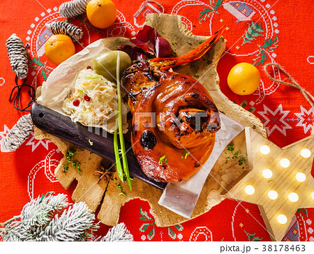 Roasted pork knuckle eisbein with braised boiled cabbage 38178463