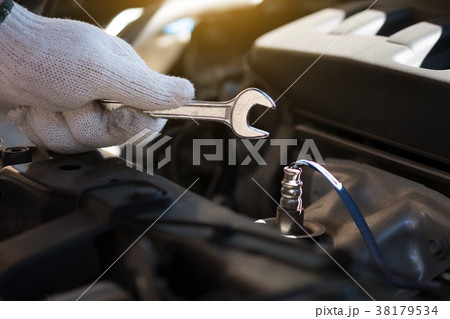 Mechanic repairing a car  in garage  Auto repair  38179534