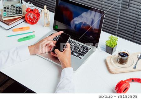 Businessman using smart phone Businessman using smart phone 38185808