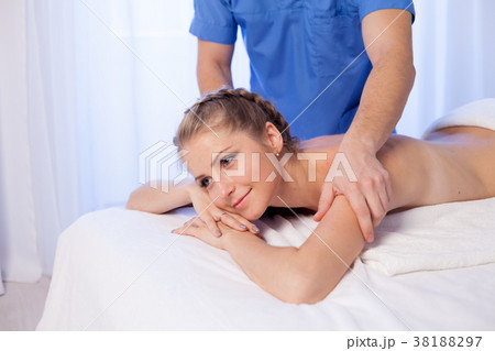 beautiful girl make therapeutic massage in the Spa beautiful girl make therapeutic massage in the Spa 38188297