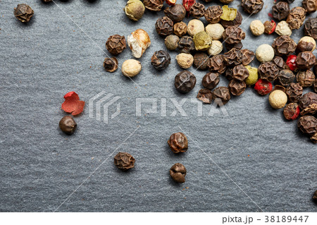 mixture of pepper peas powder scattered on a slate 38189447