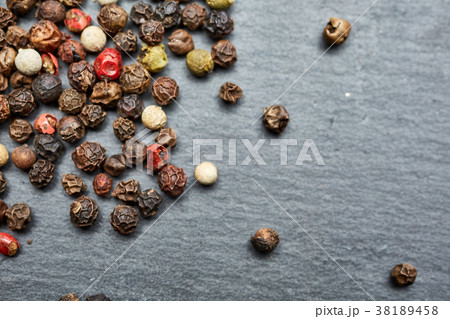 mixture of pepper peas powder scattered on a slate 38189458