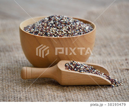 Quinoa grain in wood bowl with spoon on wooden 38193479