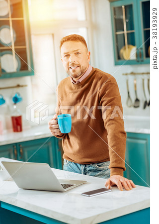 Handsome nice man standing in front of the laptop 38193929