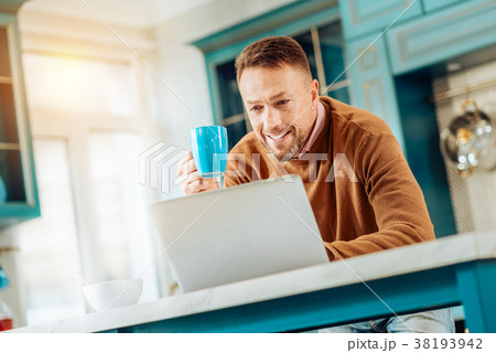 Positive nice man holding a cup 38193942
