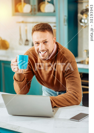 Cheerful bearded man standing in front of the 38193943