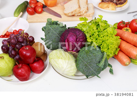 vegetables and fruit on kitchen table vegetables and fruit on kitchen table 38194081