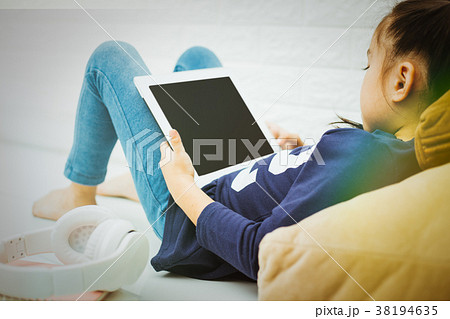 Wireless router and kids using a Tablet in home 38194635