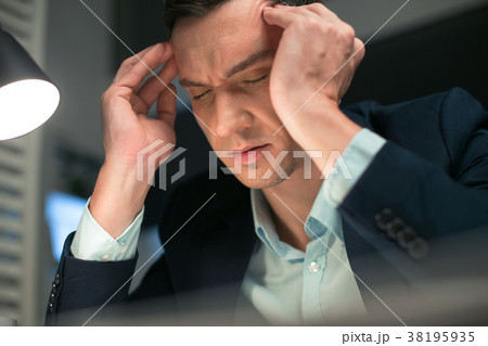Cute calm businessman tired from work 38195935