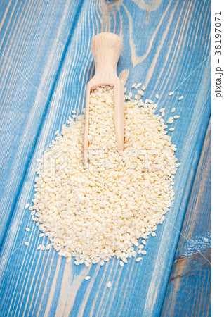 Heap of sesame seeds on wooden boards 38197071