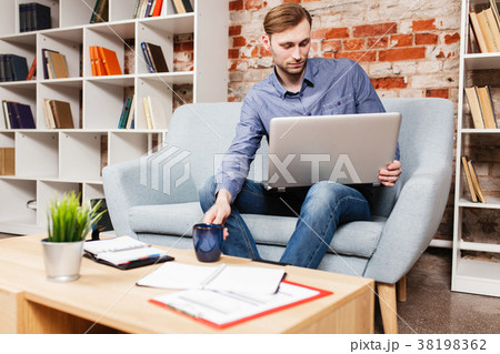Young man with a laptop 38198362