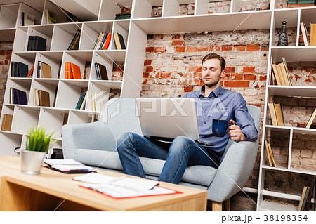 Young man with a laptop 38198364