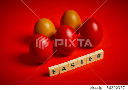 colored eggs and text on a red background colored eggs and text on a red background 38200327