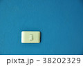 White plastic power switch on the blue wall 38202329