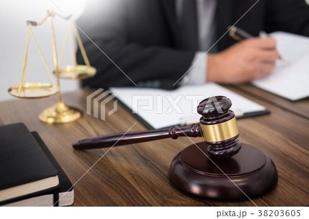 lawyer hand writes the document in court (justice, law) with sou lawyer hand writes the document in court (justice, law) with sou 38203605