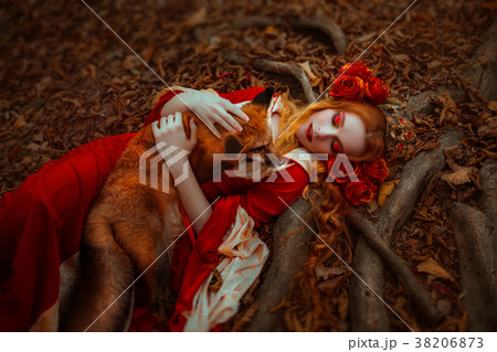 Woman in medieval clothes with a fox 38206873