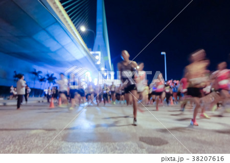 Abstract blurred many marathon runners Abstract blurred many marathon runners 38207616