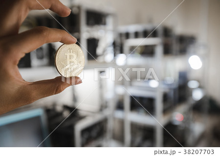 Gold coin on the background of computer devices Gold coin on the background of computer devices 38207703